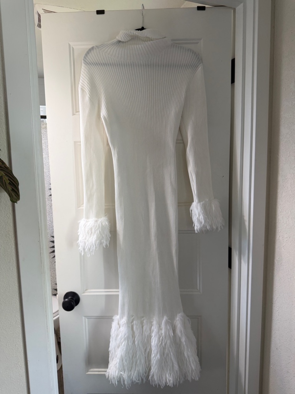 Feathered white sweater dress